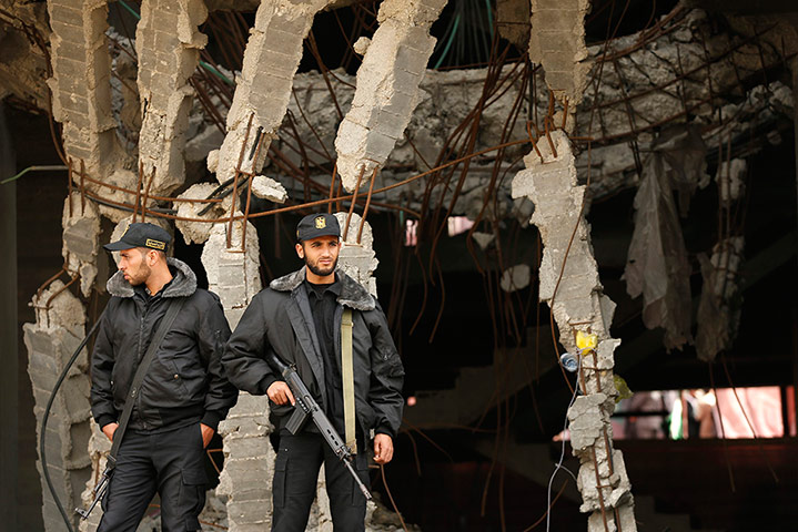 Members of Hamas security forces stand guard