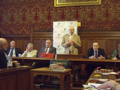 Corbyn (seated, white jacket) photographed by me at a Palestinian Return Centre event in 2012.